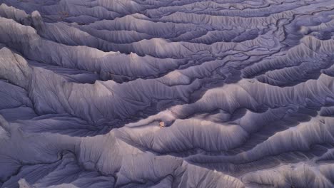 textured purple utah desert terrain at dusk, aerial view