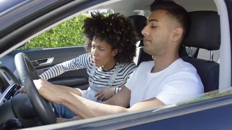 young couple having a serious talk in a car