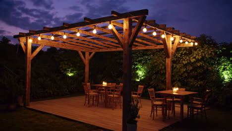 outdoor wooden pergola with string lights and patio furniture at night
