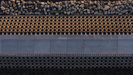 woman jogging on deserted causeway