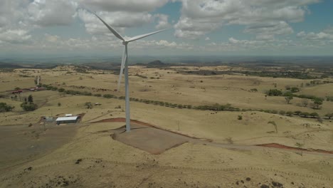 panning drone shot of a critically important wind farm located in tilaran, guanacaste, costa rica