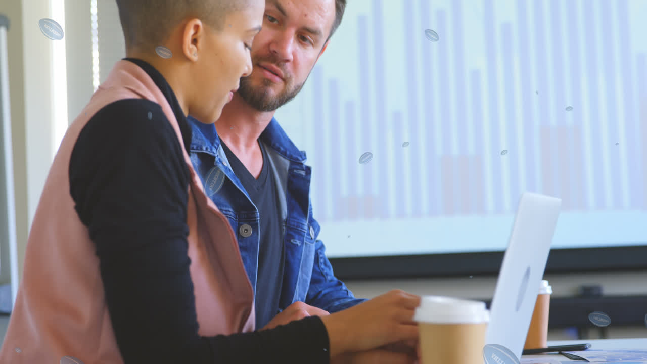 Animation of rugby balls with argentina text over caucasian business people talking