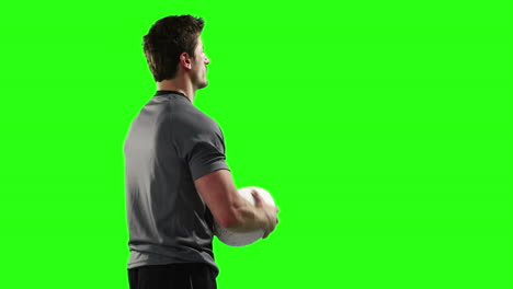 serious rugby player with ball