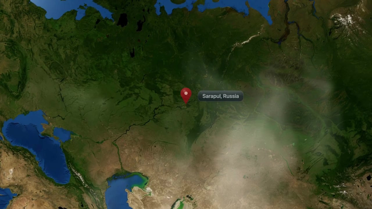 Satellite camera zooms rapidly from outer space to Sarapul, Russia, marked with a pin. Includes NASA public domain imagery.
