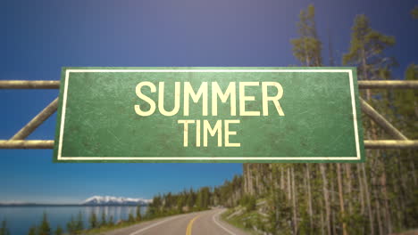 summer time on road sign with road and forest in daytime