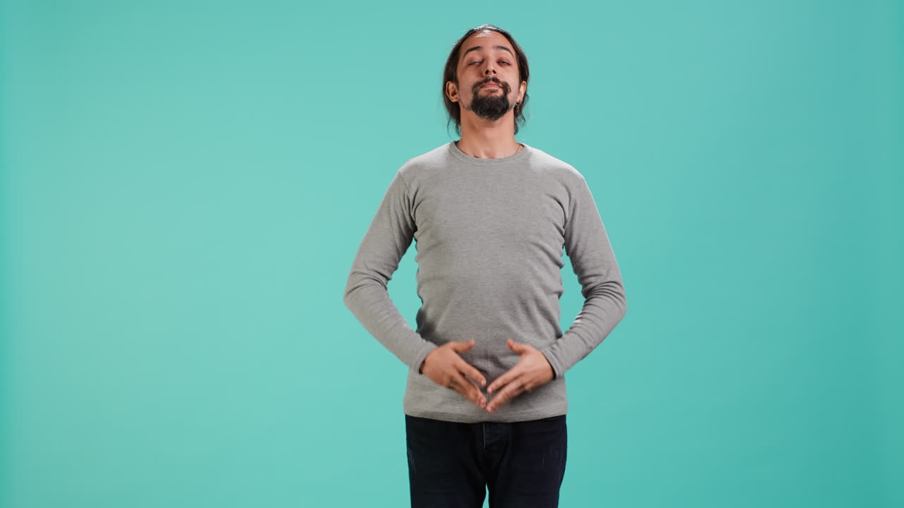 Portrait of zen man inhaling and exhaling