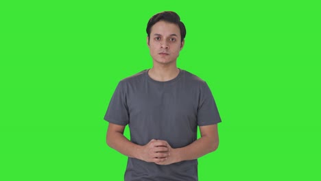 angry indian man staring at the camera green screen