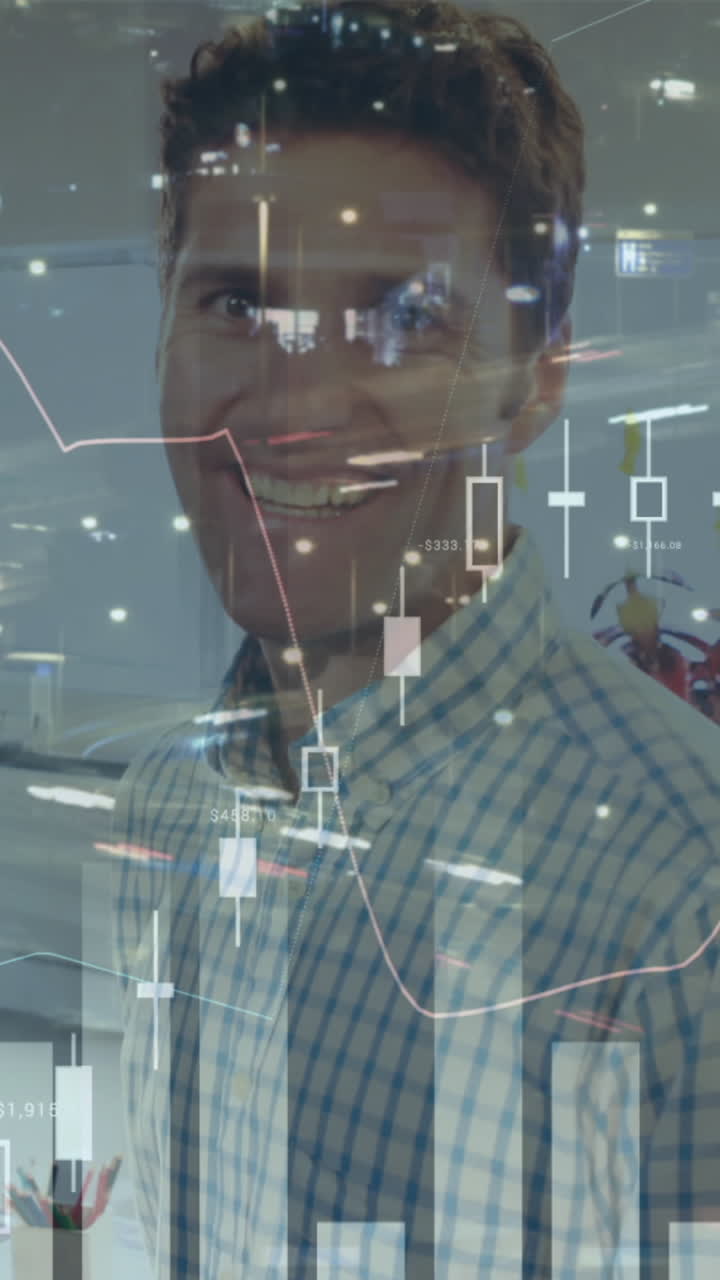Composite video of statistical data processing against portrait of caucasian man smiling at office