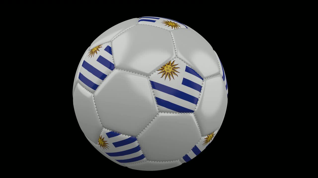 Pallone da calcio con bandiera dell'Uruguay vola davanti alla telecamera, rallentatore, canale alfa