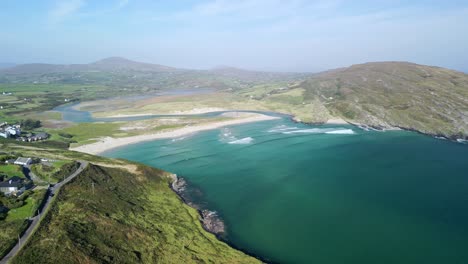 flying a drone above coastal west cork and barleycove beach with golden sand and turquoise waves of the atlantic