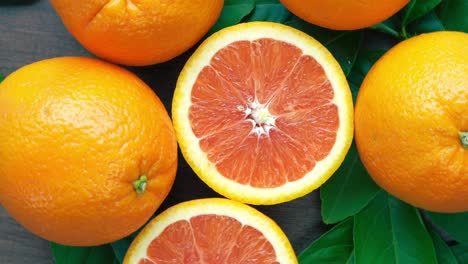 orange with leaves in basket on wooden background, top view rotate grapefruit or cara cara orange on wooden background, 4k resolution.