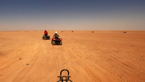 quad bikes driving at safari desert in hurghada, egypt