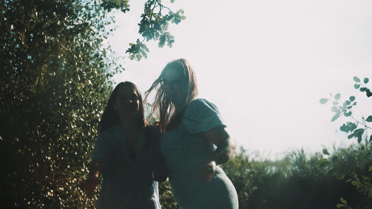 Two girls playing with water guns