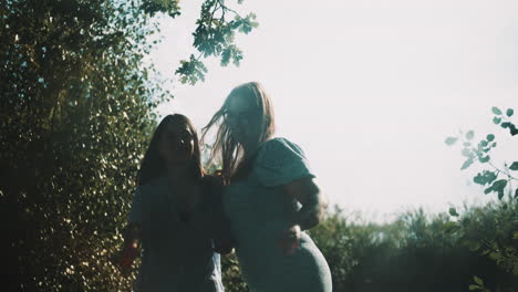 two girls playing with water guns