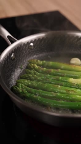 cooking asparagus in a pan