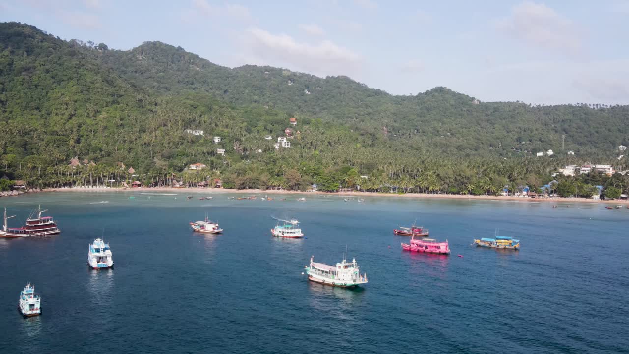 Aerial View Over Moored Boats In Gulf Of Thailand With Push Forward Shot Towards Sairee Beach