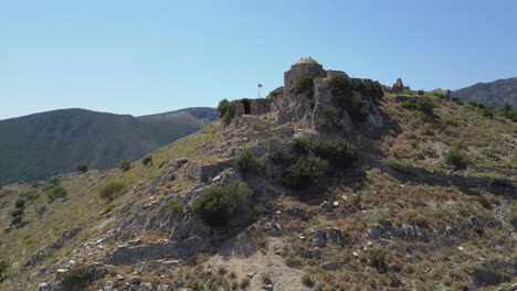 aerial view of ancient castle ruins on a mountain