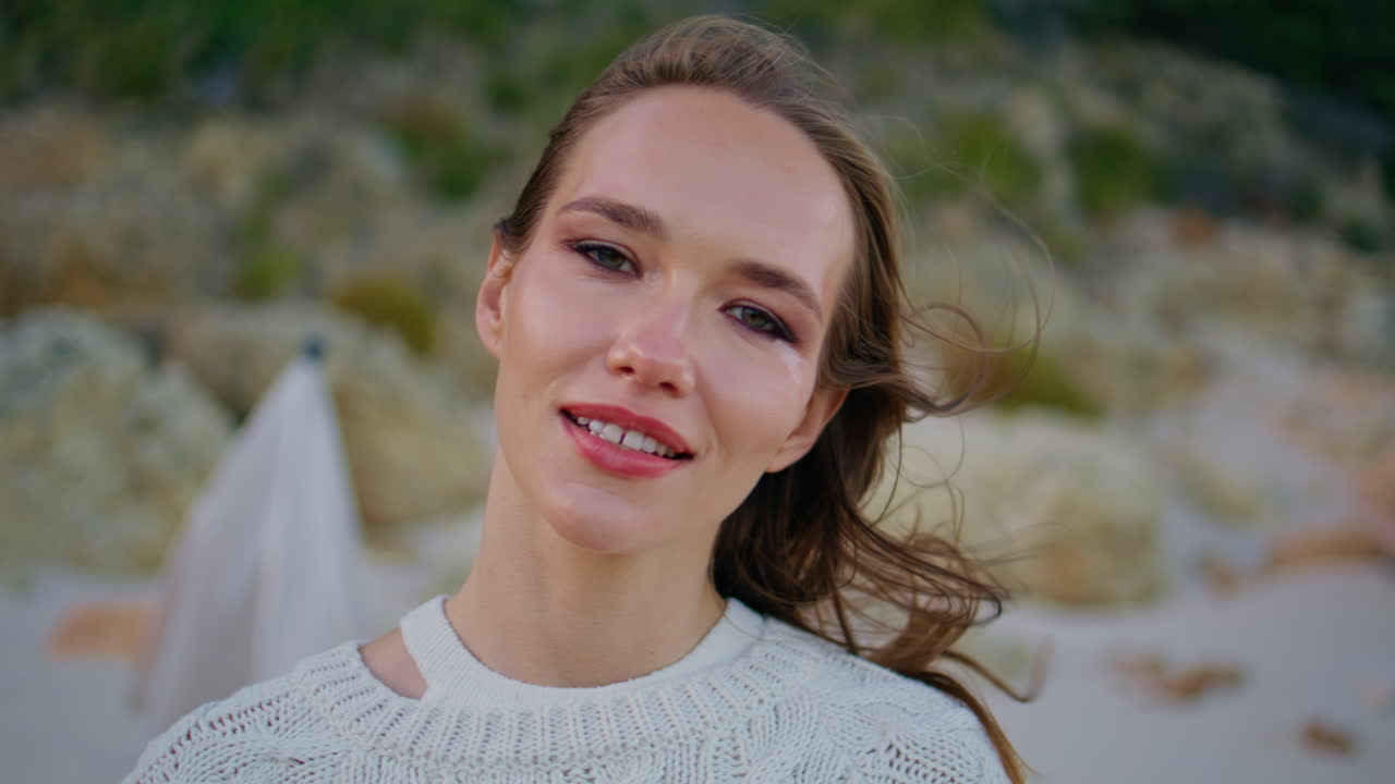 Portrait relaxed model looking camera on evening landscape. woman