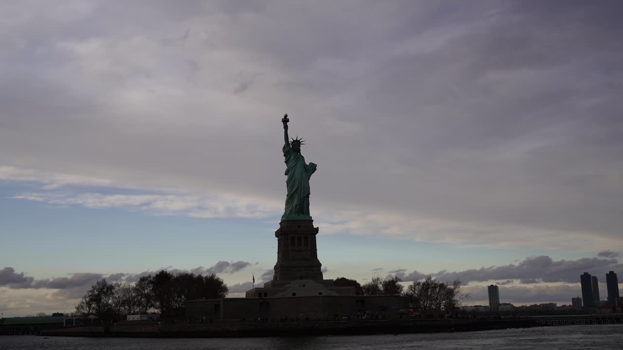 The Statue of Liberty over the Scene of New york cityscape river side which location is lower manhattan,Architecture and building with tourist concept