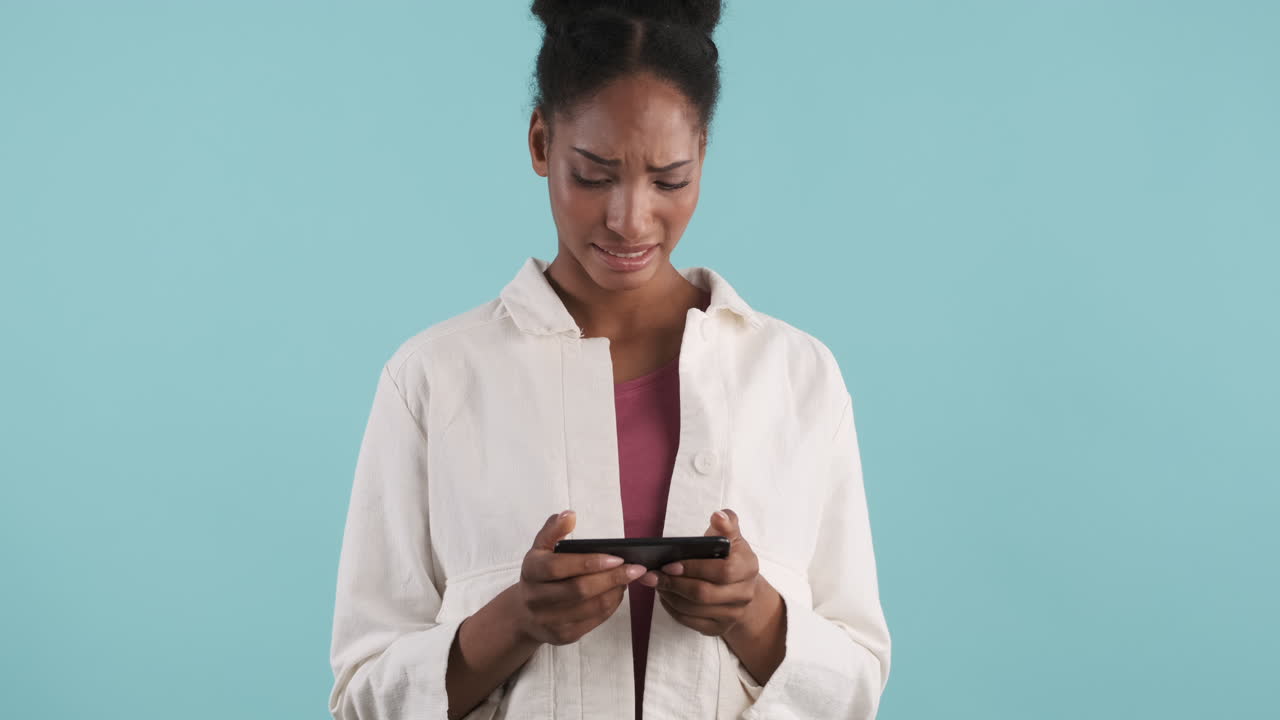 Woman showing disgusting face while watches a video