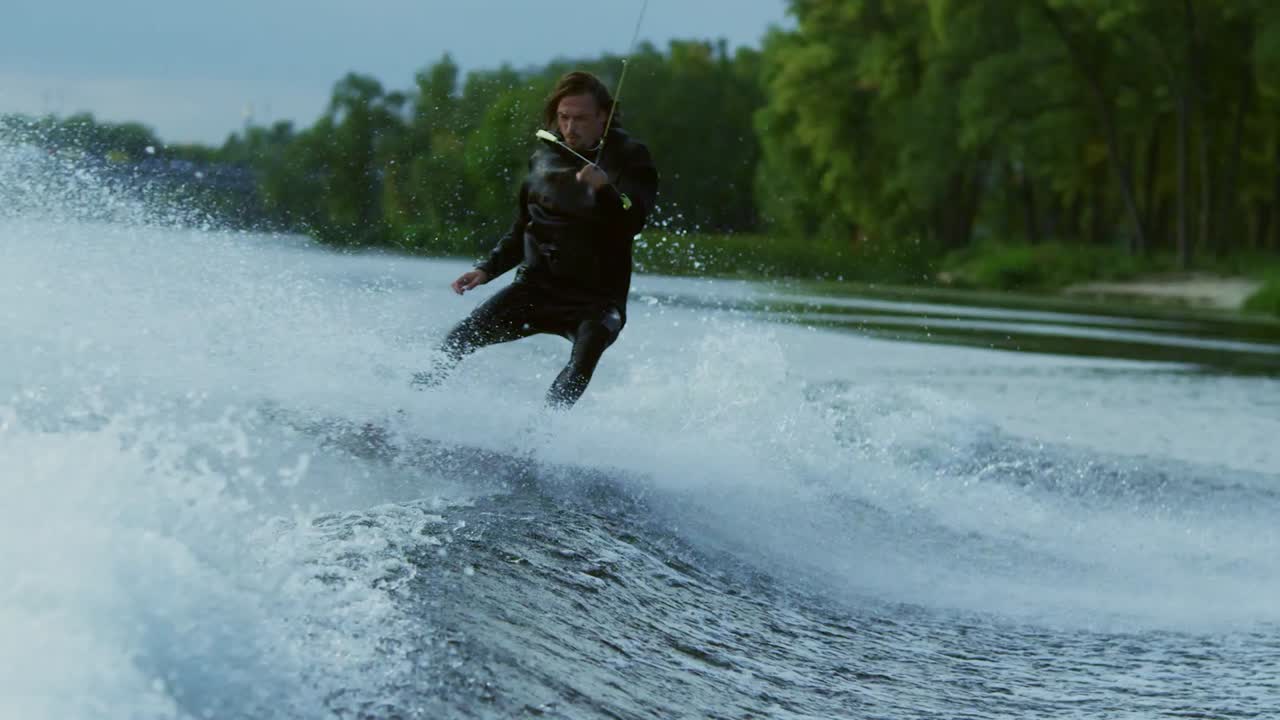 Man wakeboard boat on river. Extreme water sports. Extreme lifestyle