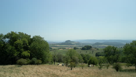 zoom with a drone on a volcano, on which the castle ruin hohentwiel can be seen in summer