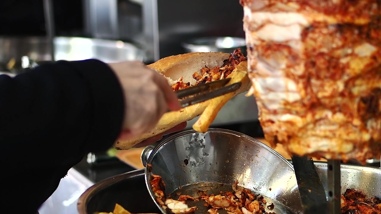 Chef Preparing a Delicious Doner Kebab Sandwich