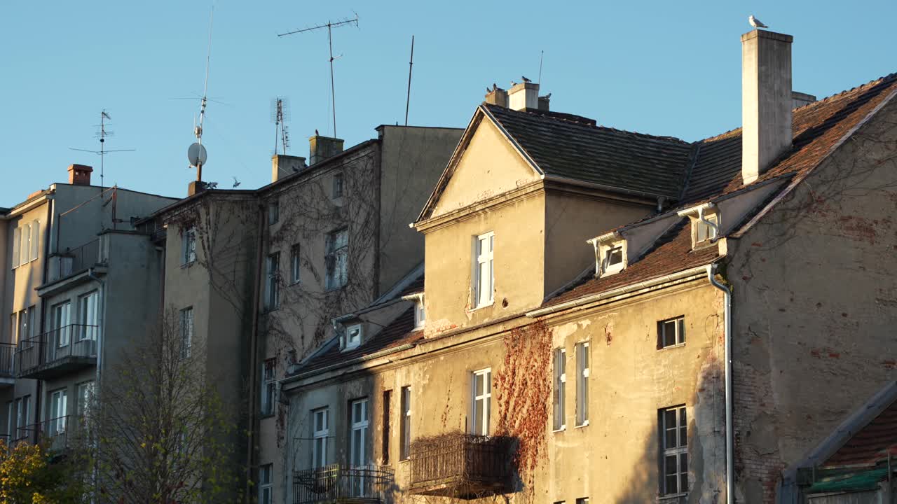 Gdynia city street with old townhouses and rustic vintage architecture