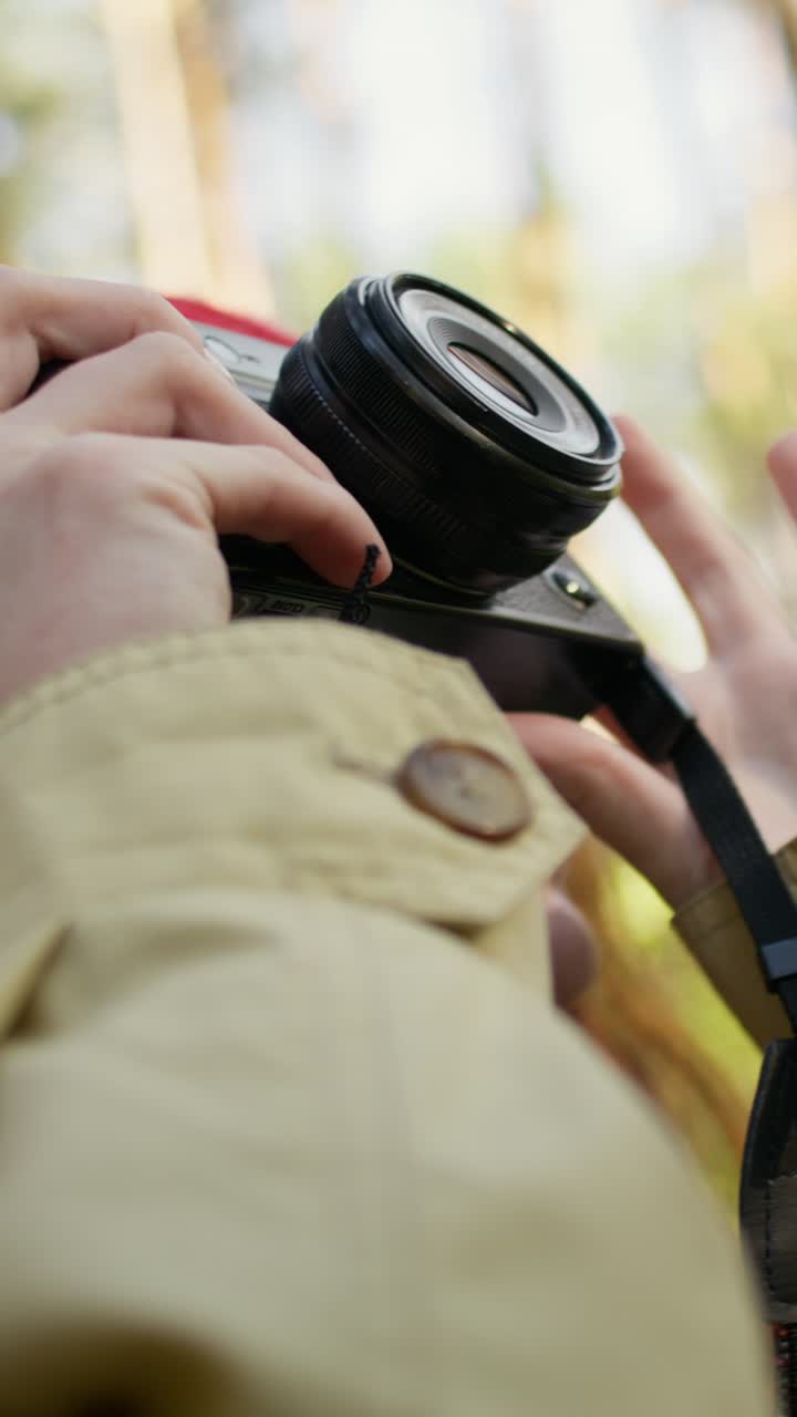 Woman taking photo in the forest