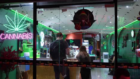 customers and clerk talking in a cannabis shop