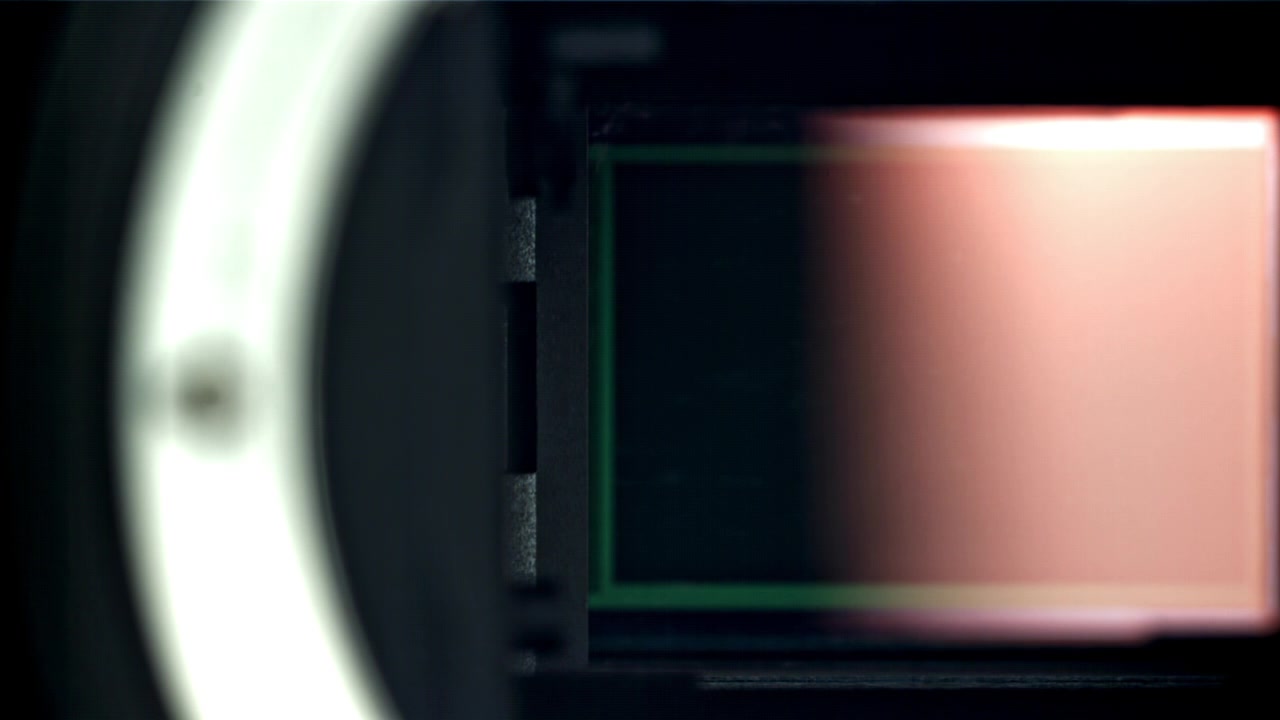 Close-up of Camera Shutter Opening and Closing to Reveal Sensor