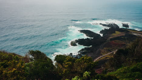 slow motion wide shot of rocky coastline