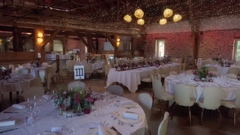 pan shot of wedding dinner table and flowers in the garden of iris in vullierens, canton of vaud, switzerland, slow motion