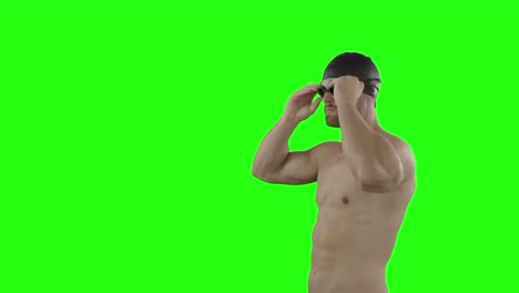 Swimmer-putting-his-swimming-goggles-and-posing