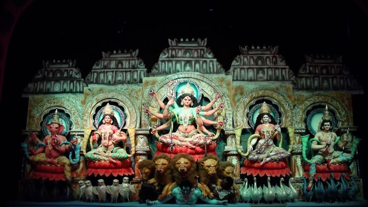 Sculpture of Indian Gods and Goddess Durga in Durga Puja festival with color changing lights