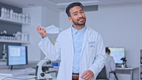 Happy-male-scientist-doing-research-to-find