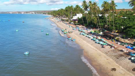 a coastal fishing village seen from above on a summer morning