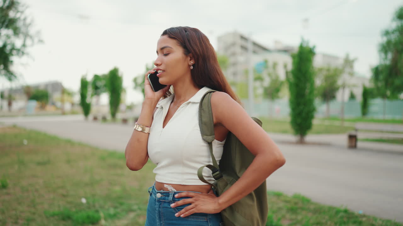 Woman walking and talking on the phone