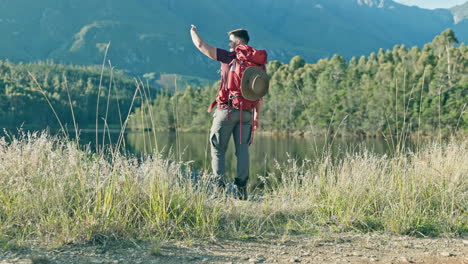 Man,-hiking-and-looking-with-hand