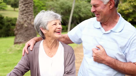 Retired-couple-in-the-park-riding-their-bikes