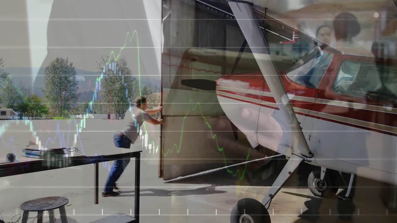 Operator pushing hangar open to tarmac, pilot checking plane controls with live stock chart overlay