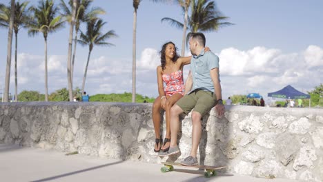 stylish happy couple relaxing on waterfront