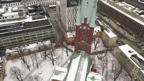 slow cinematic aerial footage rotating around very popular tourist destination, the church of klara in the capital of sweden,stockholm