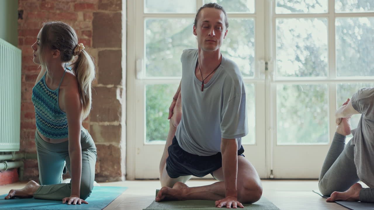 Yoga class stretching indoors