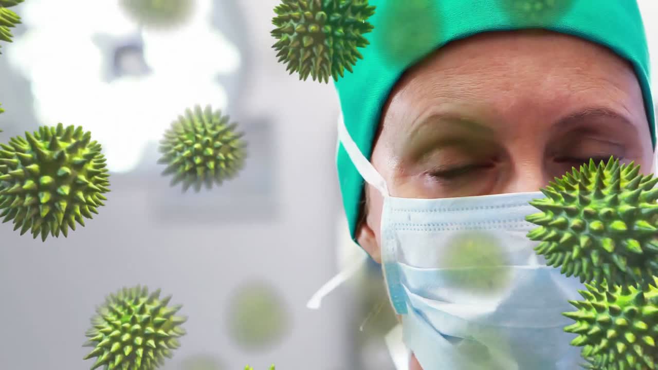 animación de la propagación del coronavirus covid19 con un trabajador de la salud en el fondo