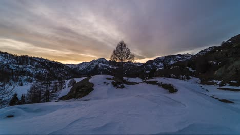 dramatic winter sunset time lapse over snowy mountain landscape, campagneda, italy