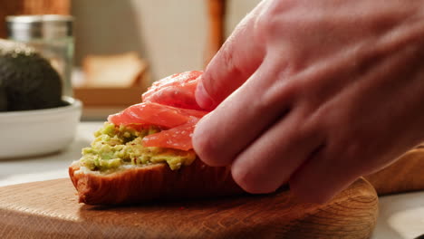 making a delicious avocado toast with smoked salmon