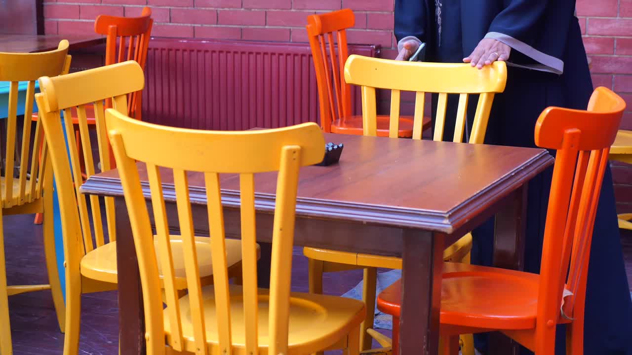 Colorful Chairs and Wooden Table in a Restaurant