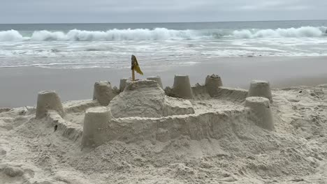 Sand-castle-on-a-sleepy-beach-vacation-background