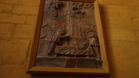 detailed bas-relief sculpture depicting a religious scene